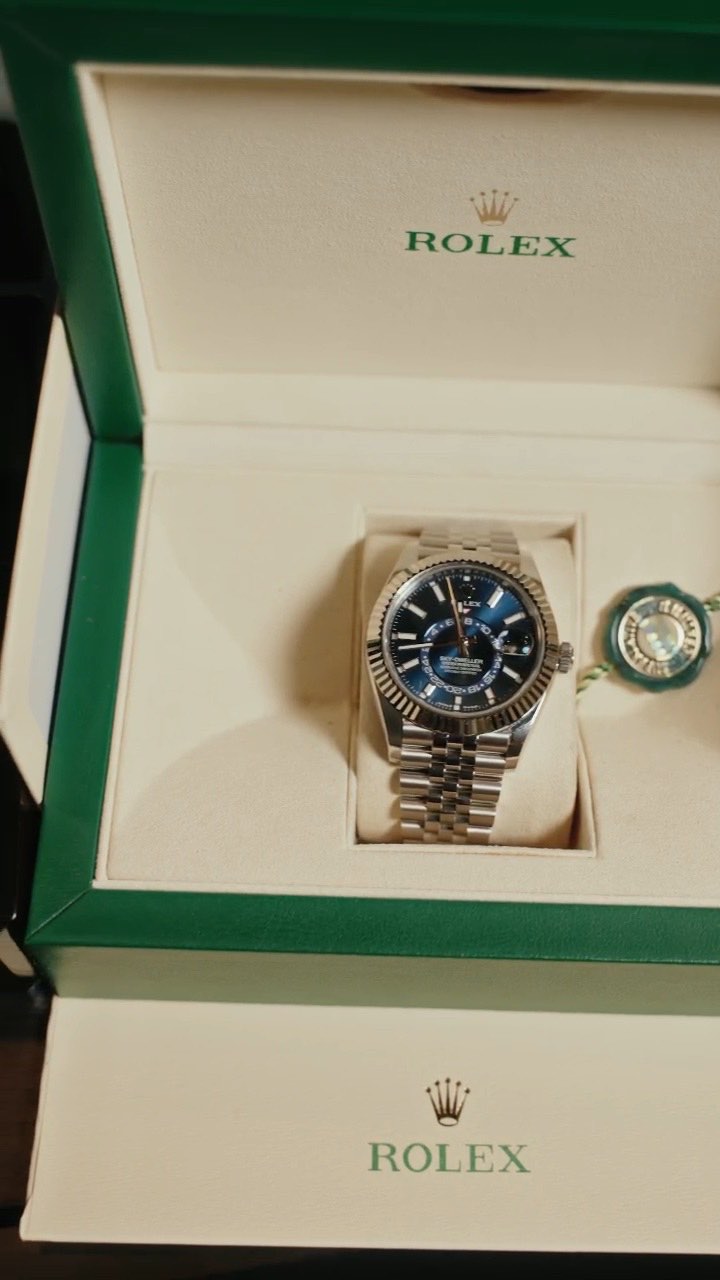 A Rolex Sky-Dweller with a blue dial in its box