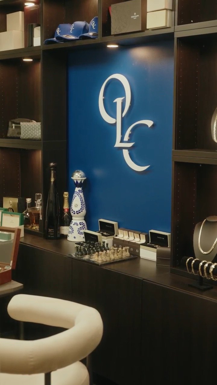 The OLC monogram on the cobalt wall at Castlemead